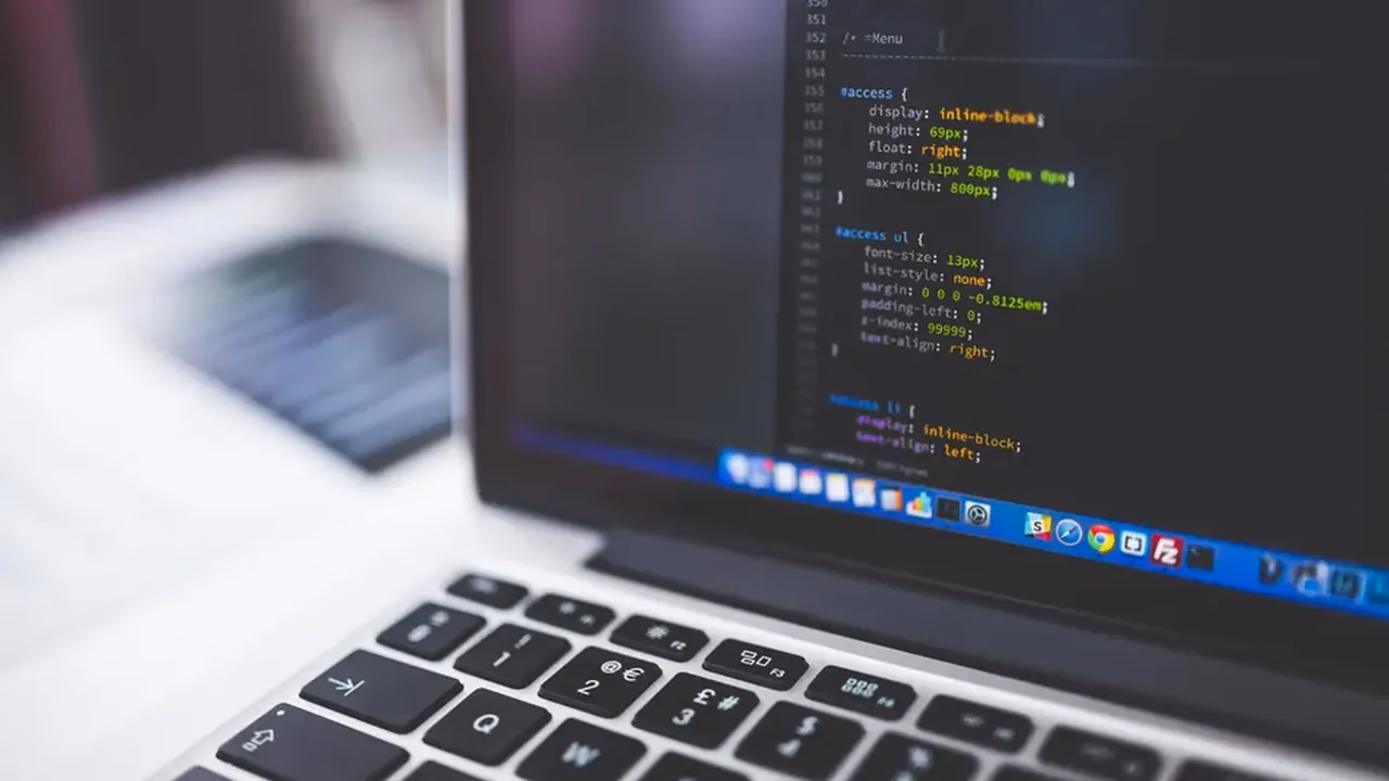 MacBook showing code in an editor while testing a Go Fiber API